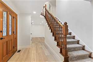 Showing Wood railing & carpeted stairs to 2nd floor