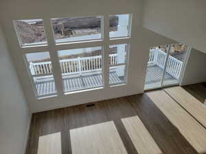 Doorway to outside featuring wood-type flooring