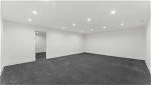 Empty room with dark carpet