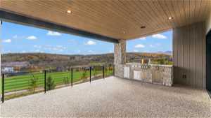 View of patio / terrace featuring a balcony, area for grilling, and a mountain view