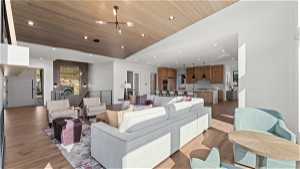 Living room featuring a high ceiling, wooden ceiling, and light hardwood / wood-style flooring