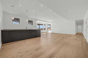 Unfurnished living room with light hardwood / wood-style flooring