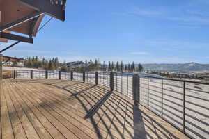 Wooden deck featuring a mountain view