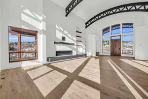 Entryway featuring hardwood / wood-style floors and a high ceiling