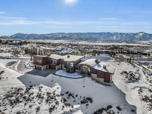 Snowy aerial view with a mountain view