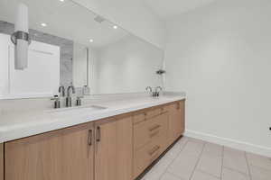 Bathroom featuring tile patterned floors and vanity