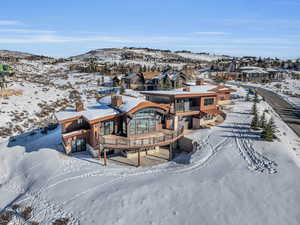 Snowy aerial view featuring a mountain view