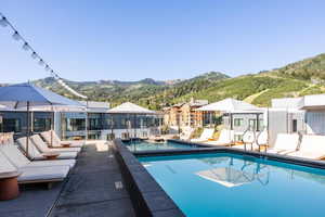 View of swimming pool with a mountain view