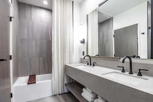 Bathroom with shower / bath combo and sink