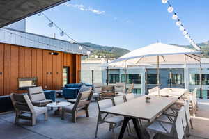 View of patio / terrace with a mountain view and an outdoor living space