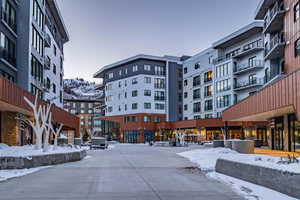 Snow covered building with a mountain view