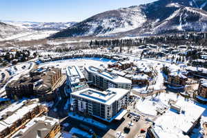 Snowy aerial view with a mountain view