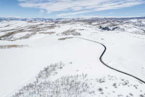 Snowy aerial view featuring a mountain view