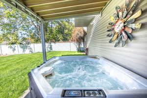 Exterior space featuring a hot tub