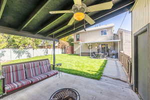 View of patio with a storage unit, ceiling fan, and outdoor lounge area