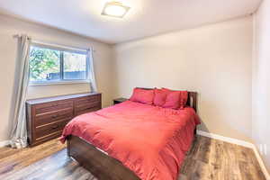 Bedroom with wood-type flooring