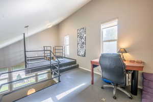 Office area with lofted ceiling