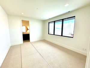 bedroom 2  featuring ensuite bath and