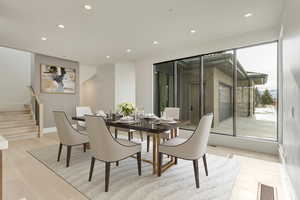 Dining room with light hardwood and resort views