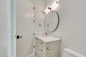 Bathroom with vanity and toilet