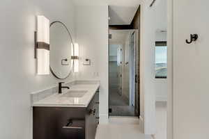 Bathroom featuring vanity and walk in shower