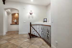 Stairway with tile patterned flooring