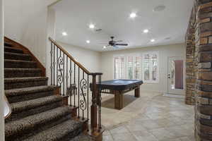 Rec room featuring billiards, light tile flooring, and ceiling fan