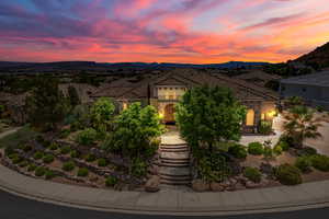 Mediterranean / spanish house with a mountain view and stucco siding
