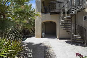 View of exterior entry featuring a patio area