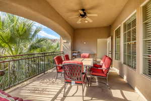 Balcony featuring an outdoor hangout area and ceiling fan