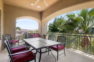 Balcony featuring a ceiling fan and outdoor dining space