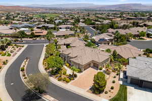 Aerial view of residential area featuring a mountainous background