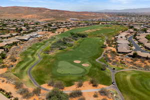 Aerial overview of property's location with nearby suburban area, a mountainous background, and a Green Springs golf course