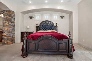 Bedroom featuring light colored carpet