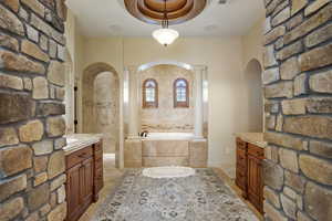 Bathroom with a bath and vanity