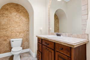 Bathroom with vanity and tile patterned floors