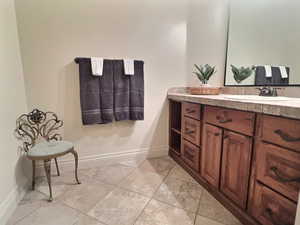 Guest Bathroom with tile floors and vanity