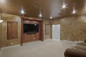 Living room with carpet and TV