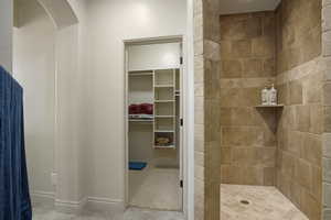 Guest full private bathroom featuring walk-in shower