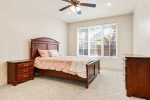 Bedroom with light carpet, recessed lighting, and ceiling fan