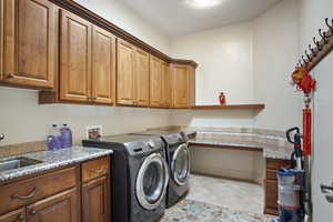 Laundry area featuring tile floors