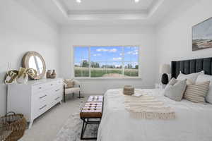 Bedroom featuring carpet and natural light