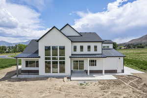 Back of property featuring a mountain view