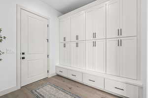 Mudroom featuring hardwood floors