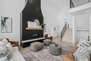 Hardwood floored living room featuring a fireplace