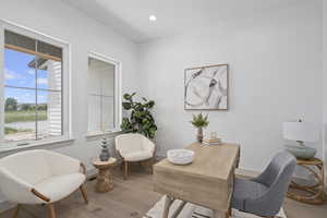 Home office featuring hardwood floors and plenty of natural light