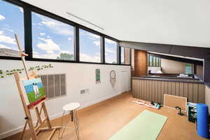 Recreation room with carpet and natural light