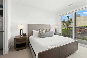 Carpeted bedroom with natural light