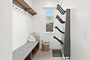 Mudroom featuring a wealth of natural light and tile flooring