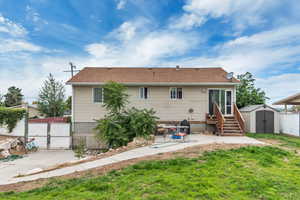 Back yard, fully fenced with patio, shed and area on the side yard for veg. garden, etc.